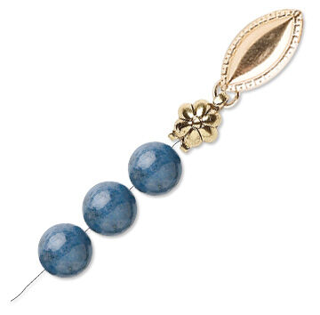 A clasp is attached to the bead strand using a bead tip.